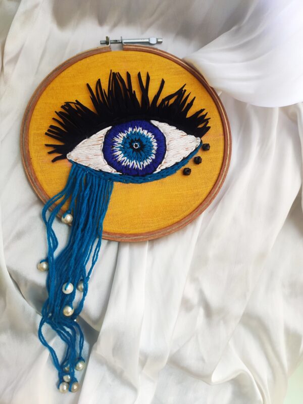 embroidered hoop art of evil eye