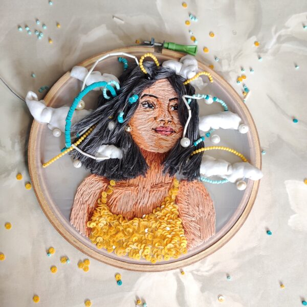 embroidered hoop art of a girl