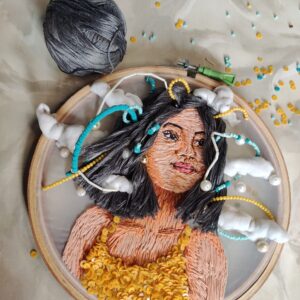 embroidered hoop art of a girl