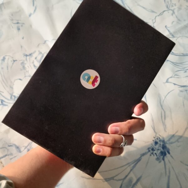 Diary with dip dye edges and artwork of guy playing guitar on cover